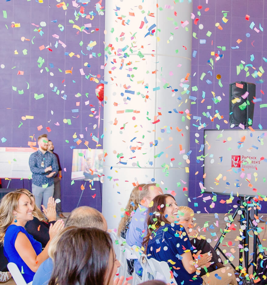 Company celebrating with confetti