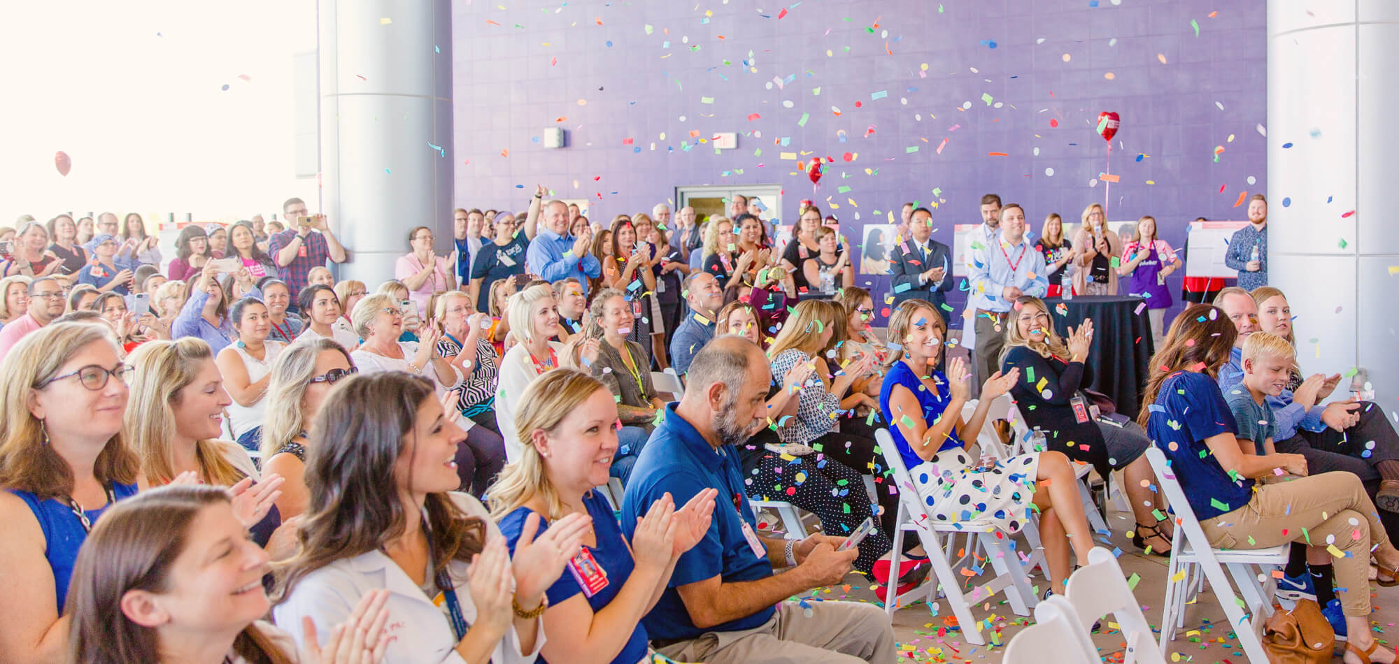 company with speaker and confetti